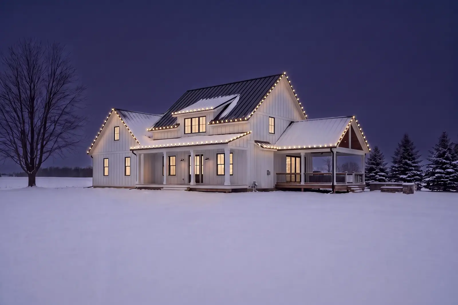 A white farmhouse in a snowy field at dusk with warm white Christmas lights on every roofline, as previewed in the online quote